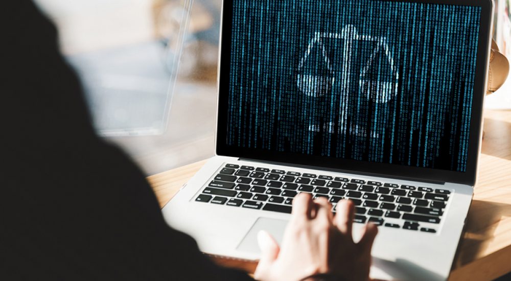 Young man working on his laptop with blank copy space screen for your advertising text message in office, Back view of business man hands busy using laptop at office desk